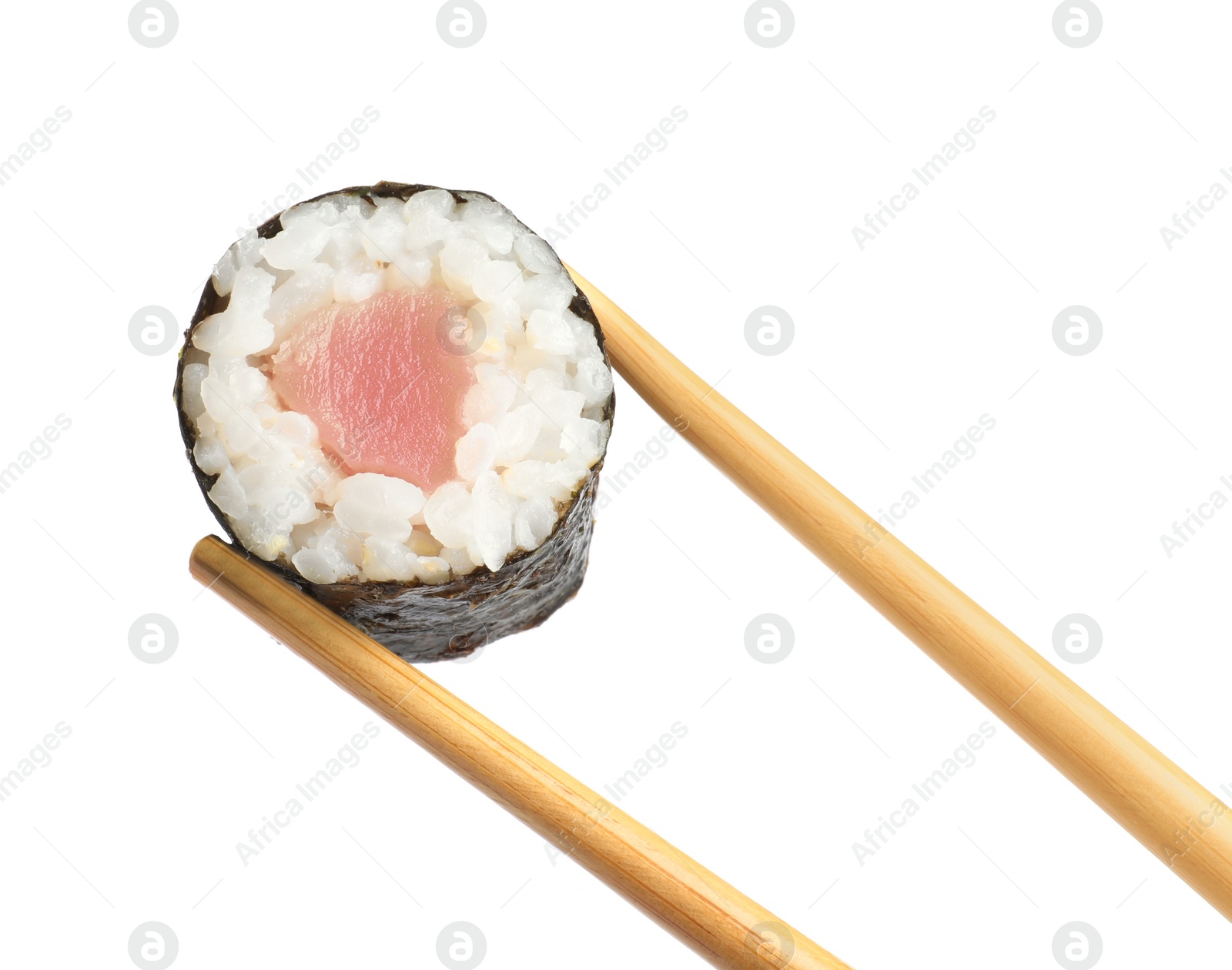 Photo of Chopsticks with tasty fresh sushi roll isolated on white