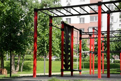 Empty outdoor gym with exercise equipment in park