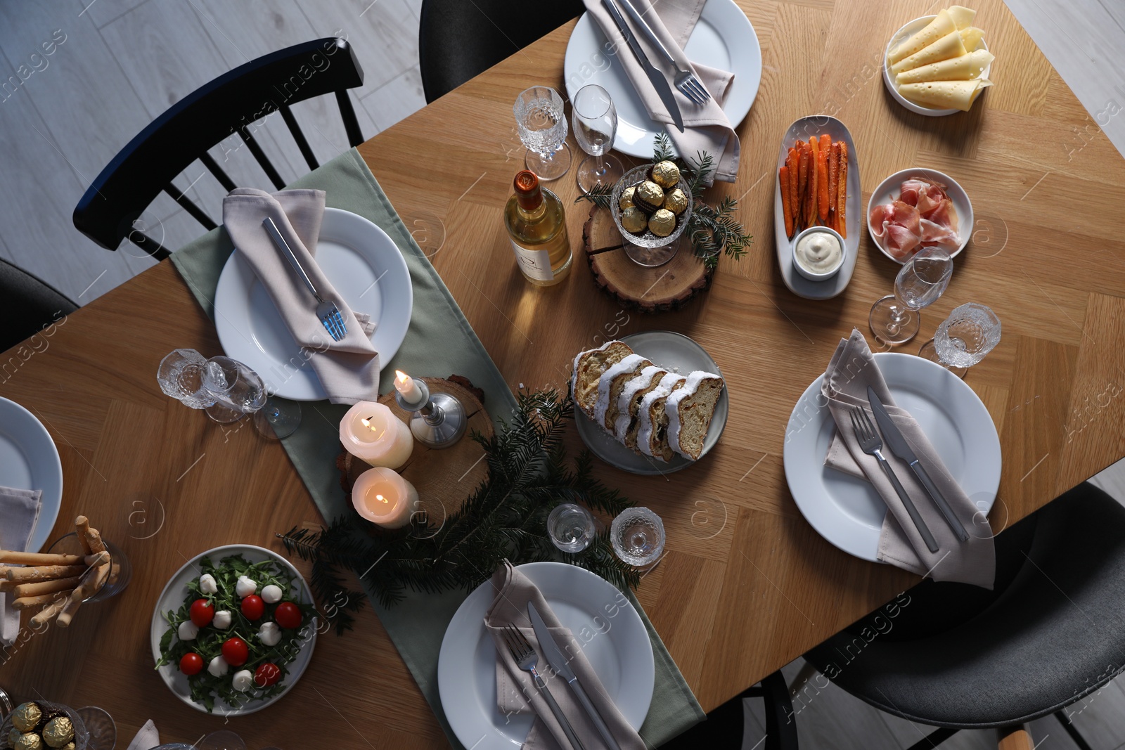 Photo of Christmas table setting with festive decor and dishware, top view