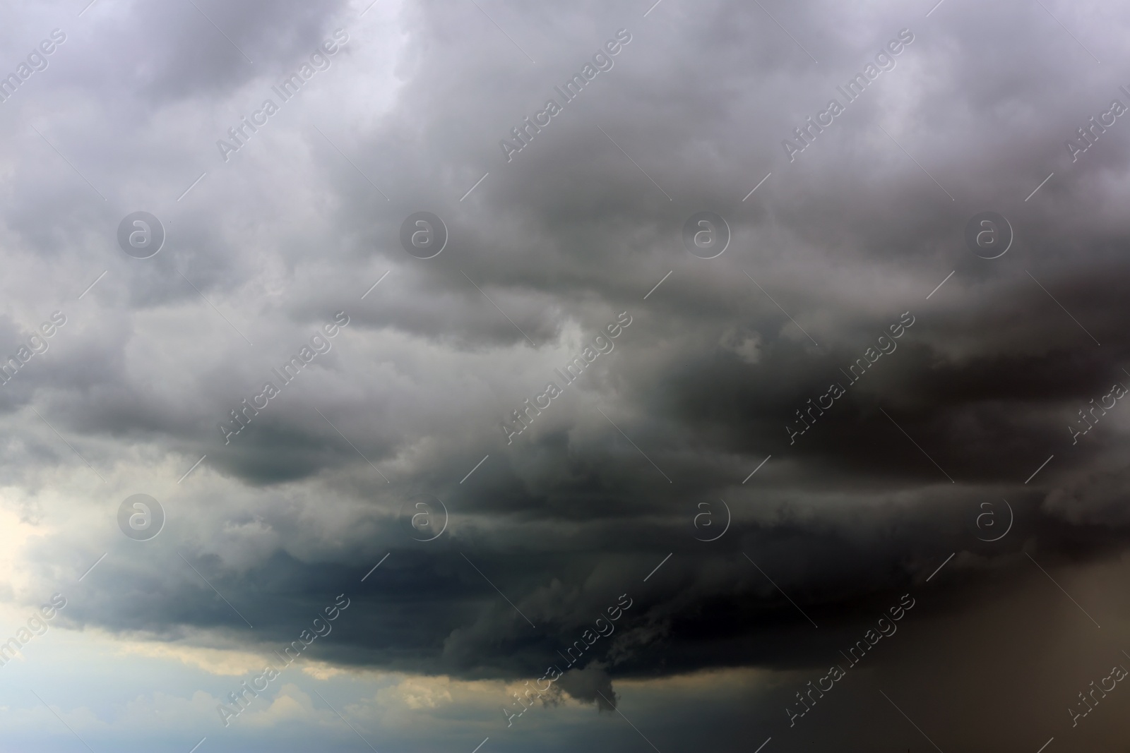 Photo of Sky with heavy rainy clouds on grey day