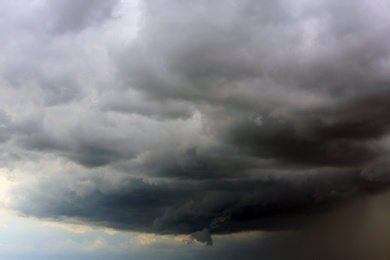 Sky with heavy rainy clouds on grey day