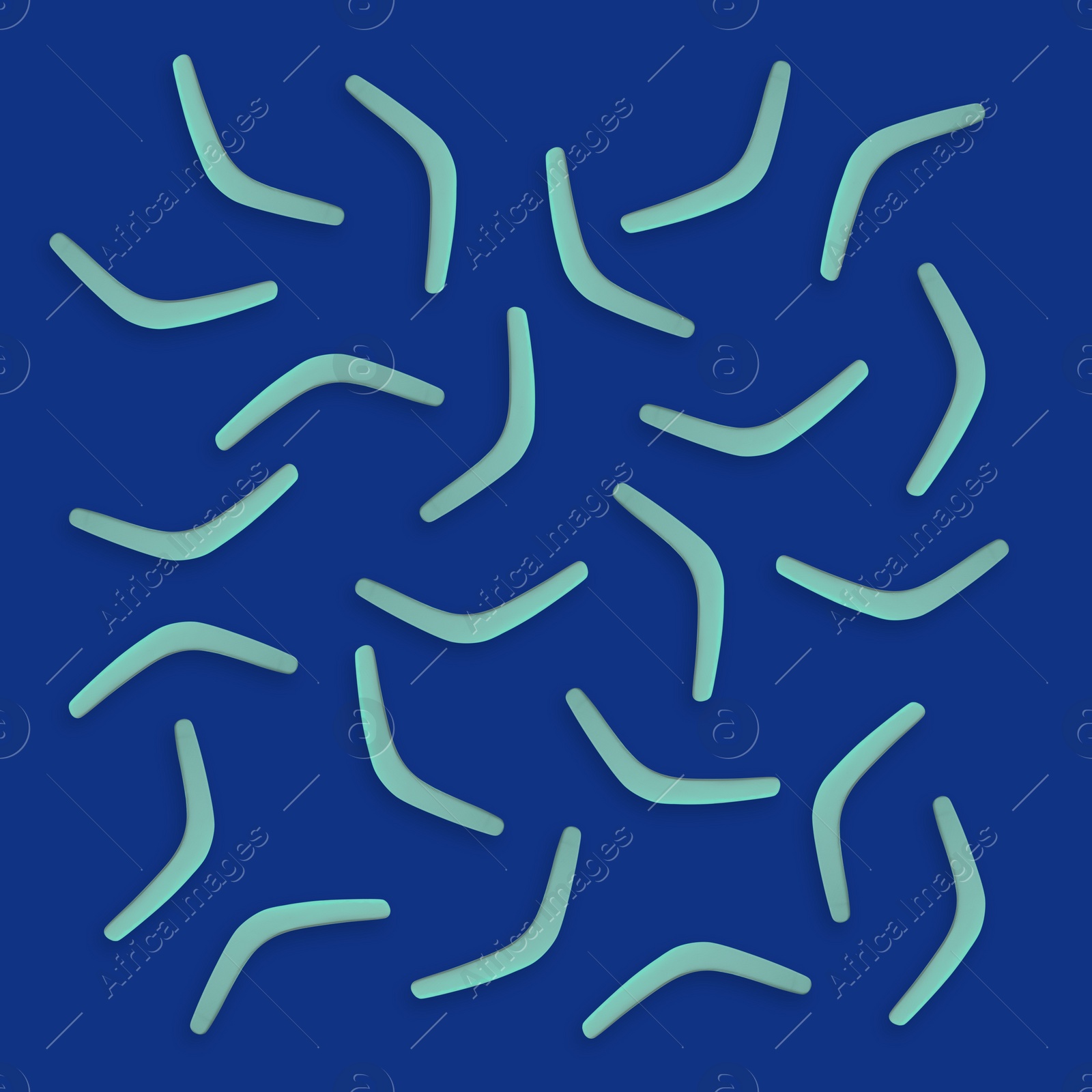 Image of Turquoise boomerangs on blue background, flat lay