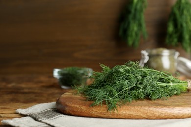 Fresh dill preparing for drying on wooden board. Space for text