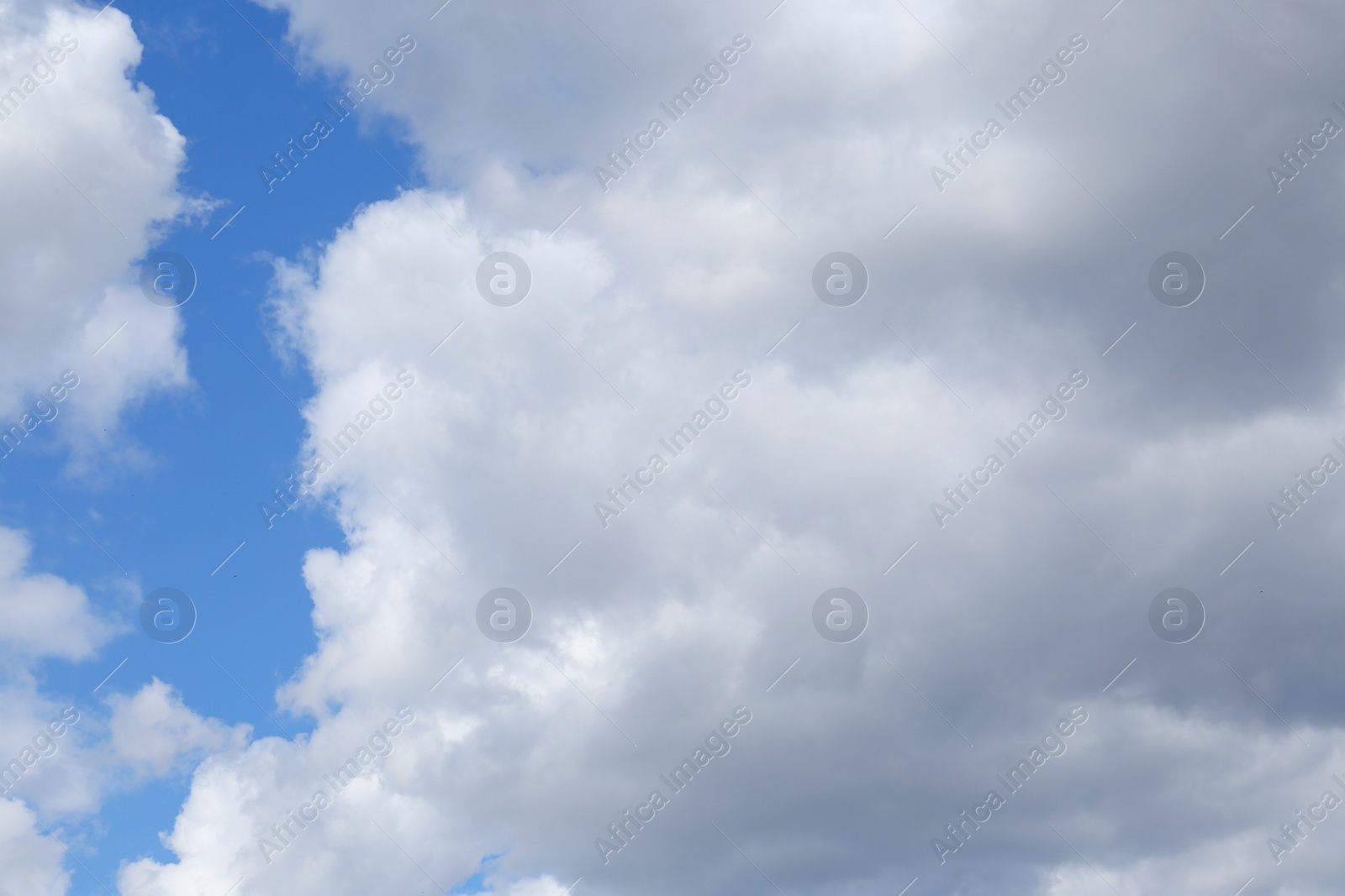 Photo of Picturesque view of beautiful fluffy clouds in light blue sky