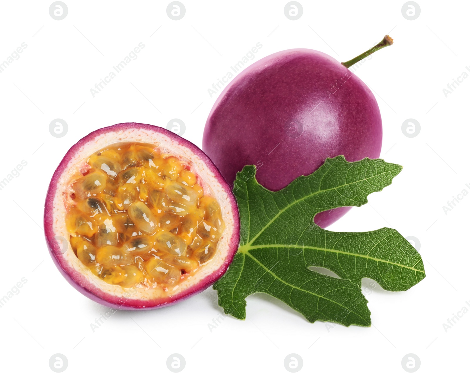 Photo of Fresh ripe passion fruits (maracuyas) with green leaf isolated on white