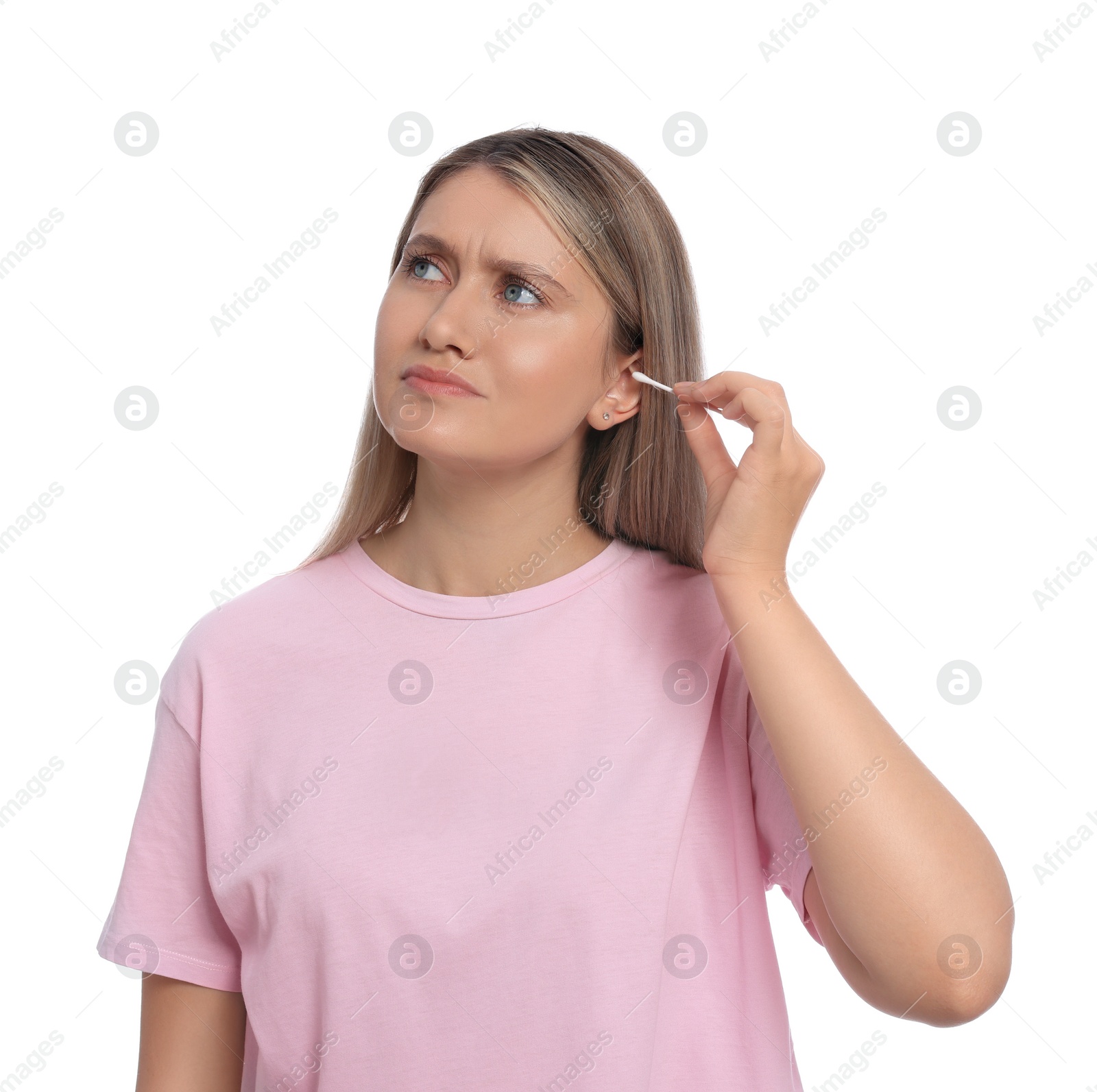 Photo of Young woman cleaning ear with cotton swab on white background