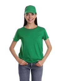 Photo of Young happy woman in green cap and tshirt on white background. Mockup for design