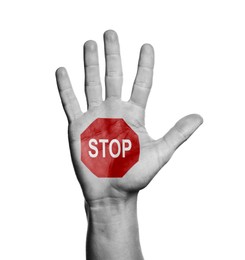 Image of Woman showing palm with drawn STOP sign on white background, closeup