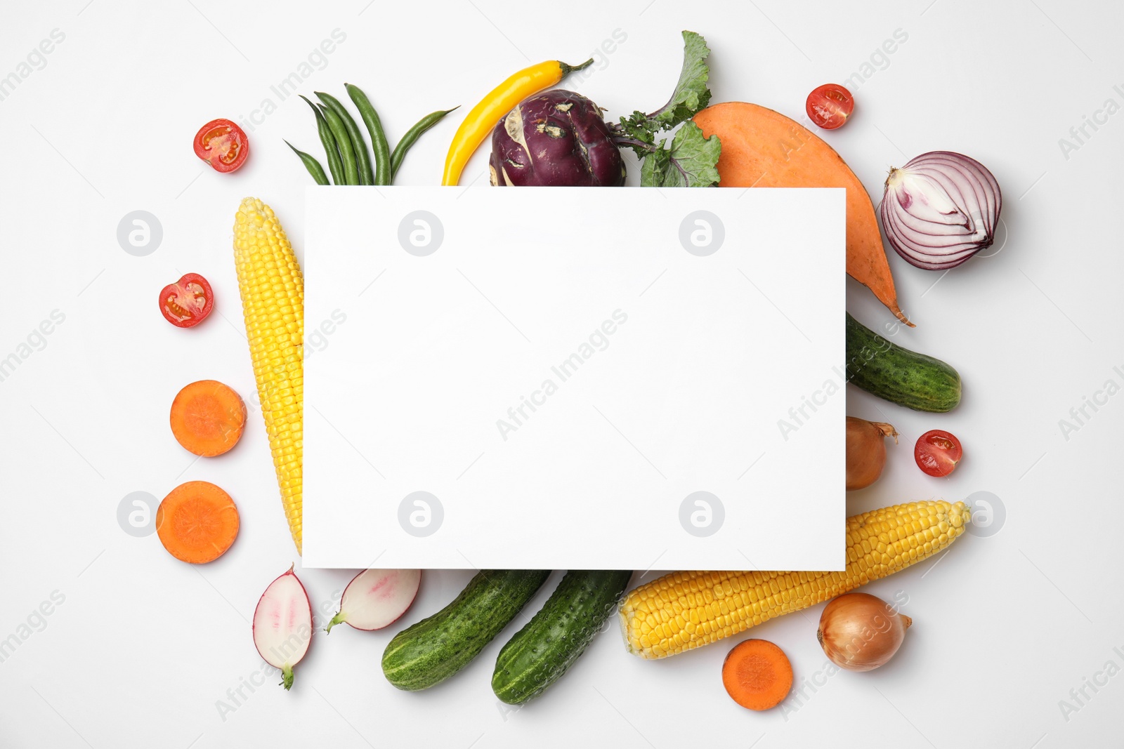 Photo of Flat lay composition with fresh vegetables and blank card for text on white background