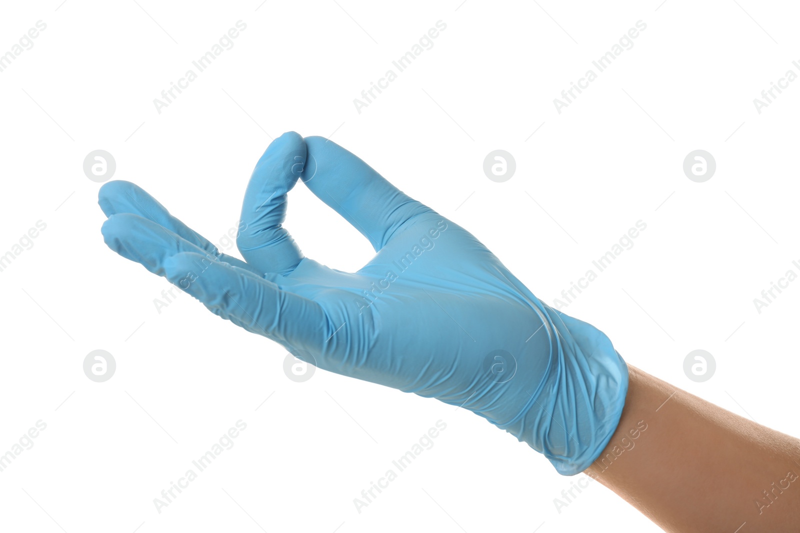 Photo of Person in blue latex gloves holding something against white background, closeup on hand