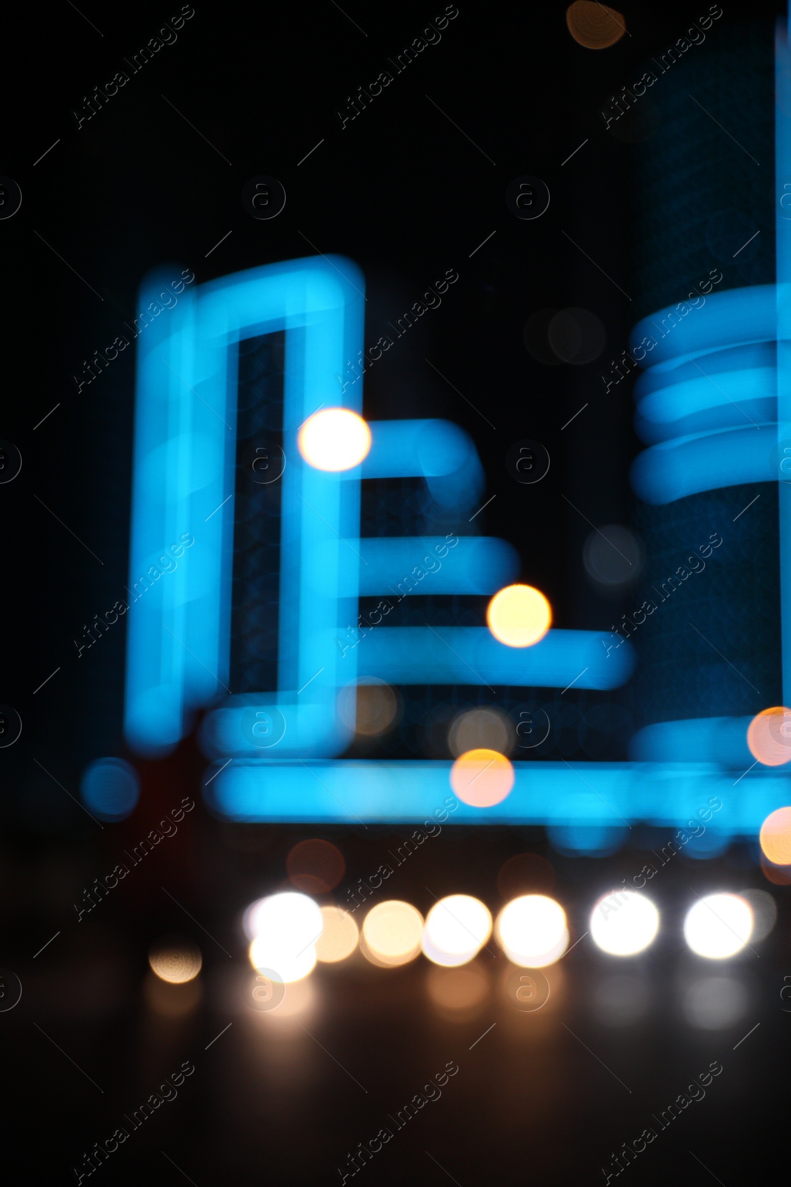 Photo of Blurred view of cityscape with bokeh effect. Night life