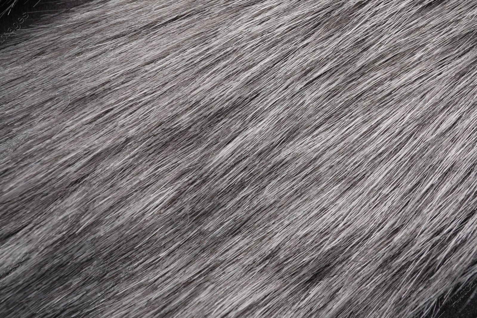 Photo of Texture of grey faux fur as background, closeup