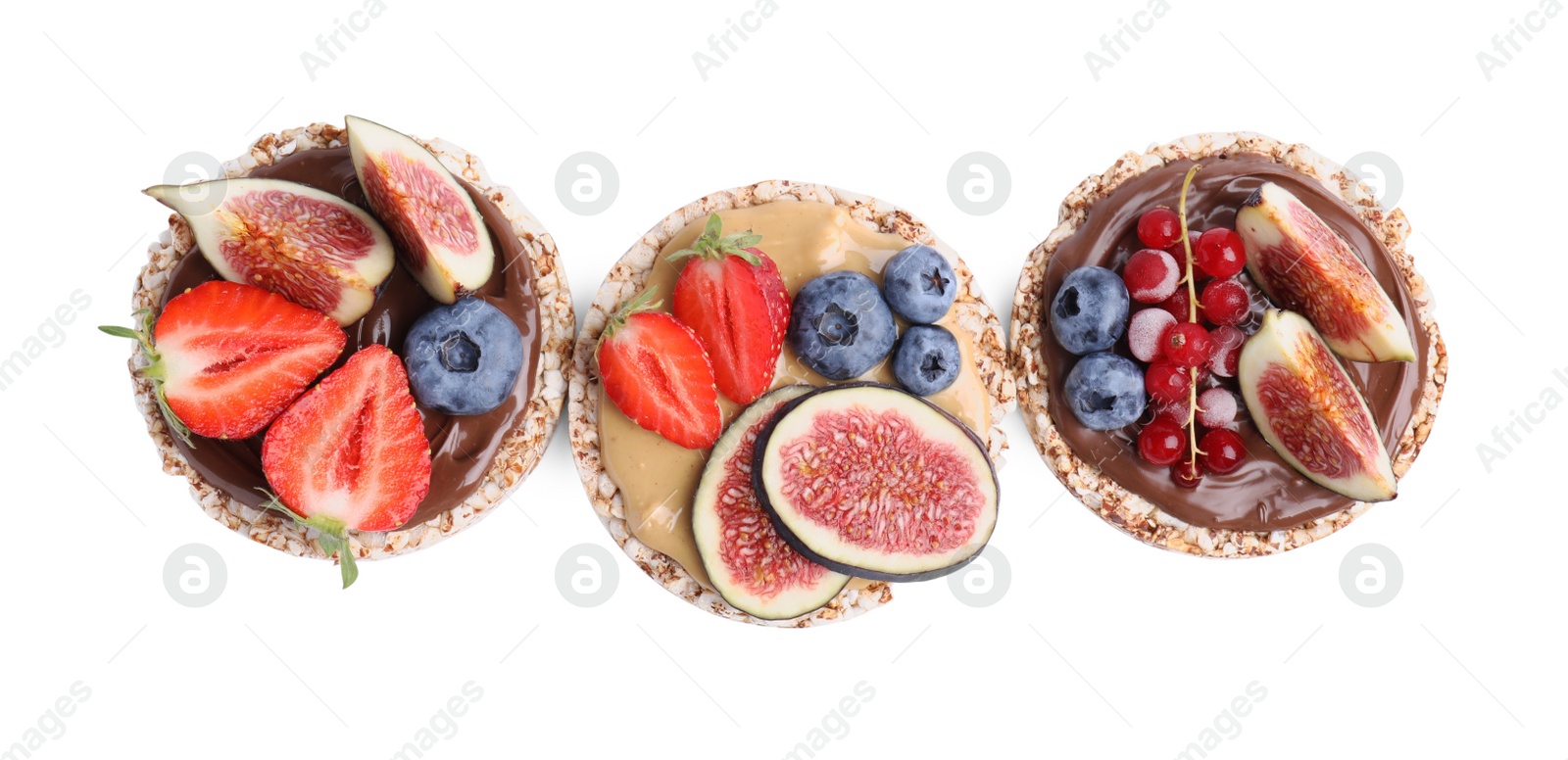 Photo of Tasty crispbreads with different toppings on white background, top view