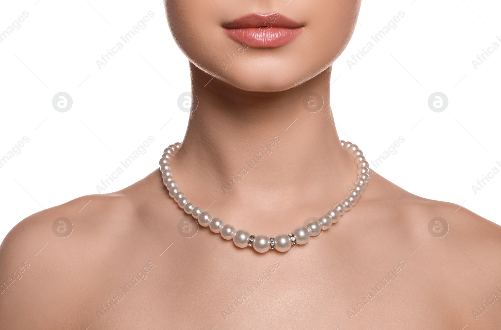 Photo of Young woman wearing elegant pearl necklace on white background, closeup