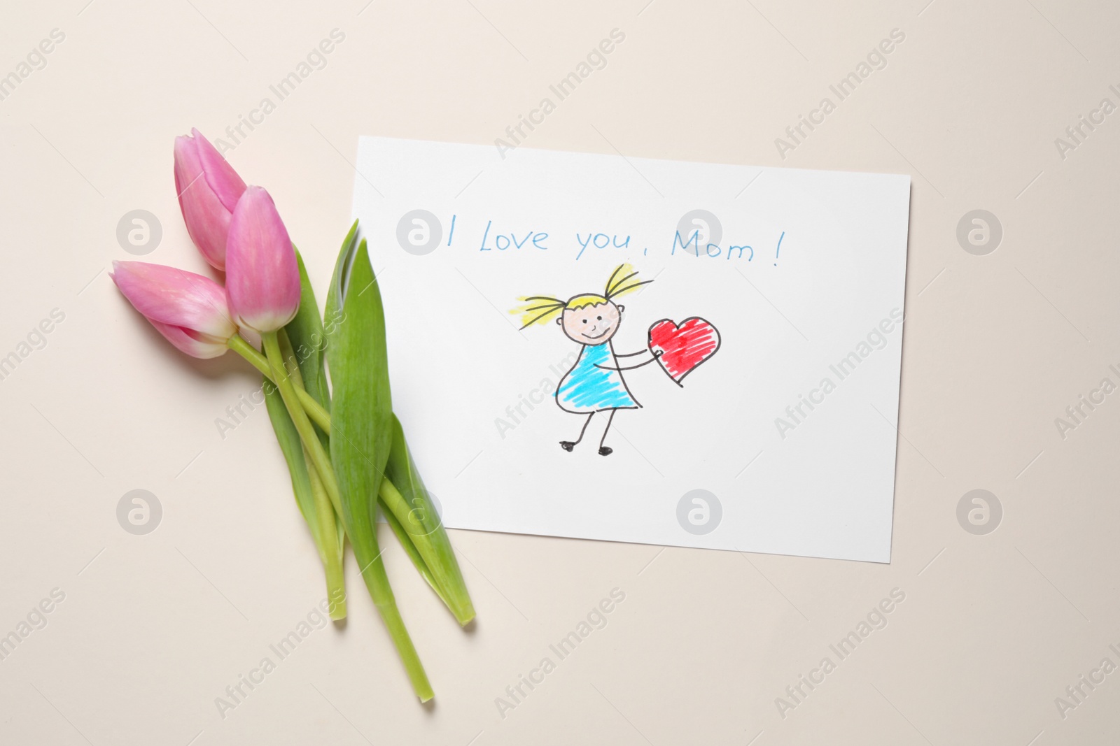 Photo of Drawing for Mother's day and beautiful tulips on beige background, flat lay