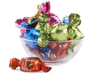 Photo of Bowl with candies in colorful wrappers isolated on white