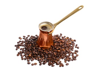 Photo of Copper turkish coffee pot with hot drink and beans on white background