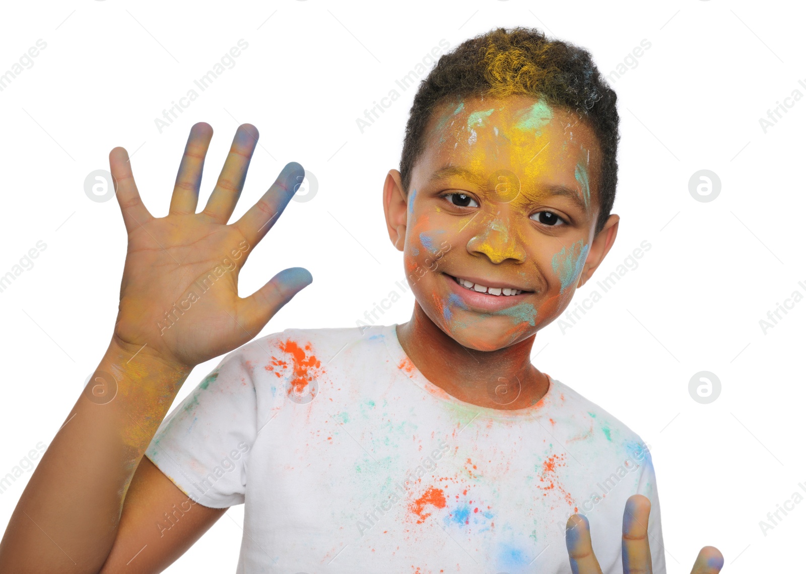 Photo of African American boy covered with colorful powder dyes on white background. Holi festival celebration