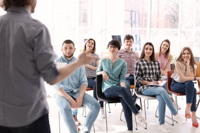 Photo of Young people having business training in office