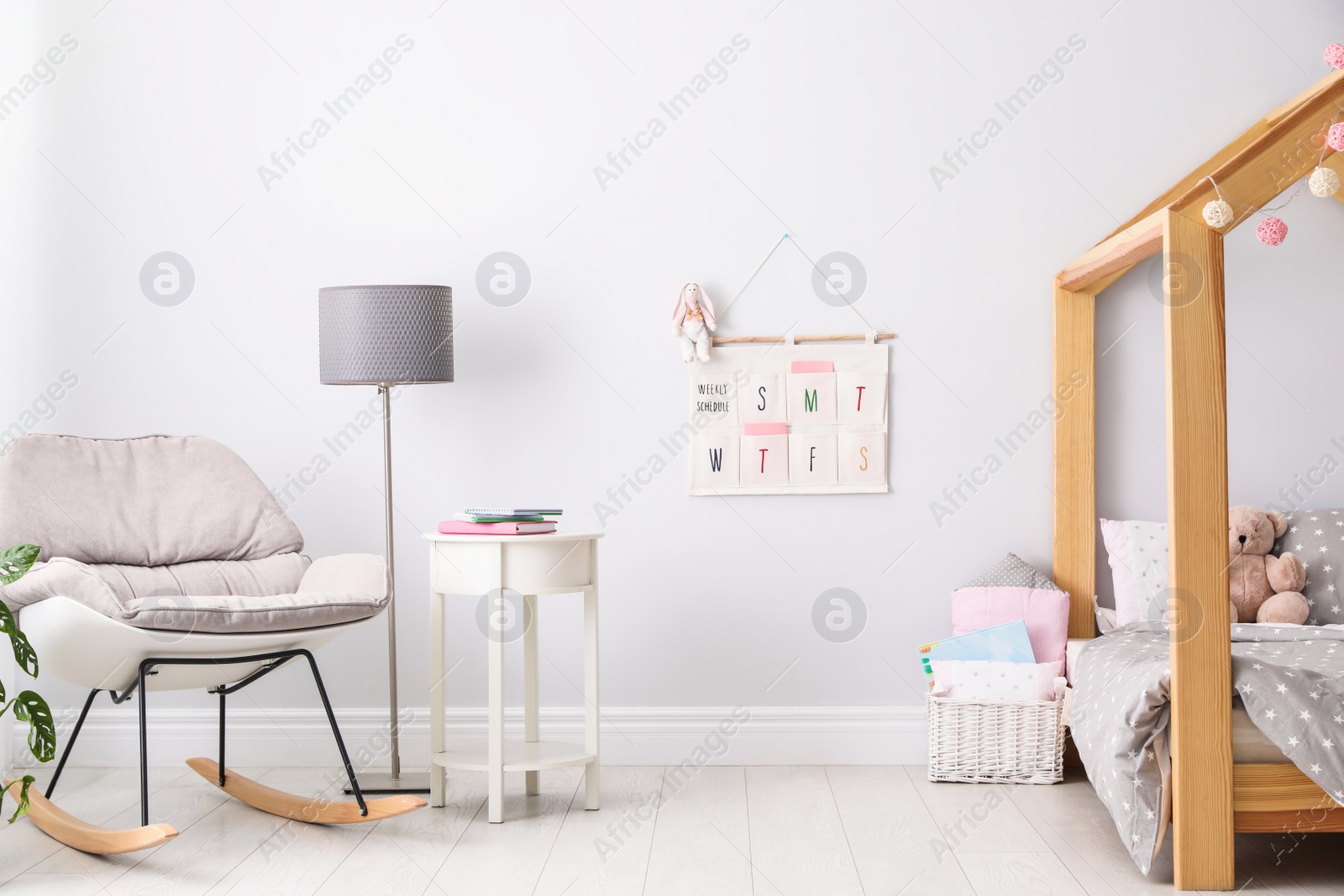 Photo of Stylish child room interior with comfortable bed