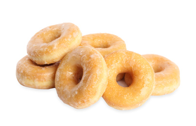 Photo of Sweet delicious glazed donuts on white background