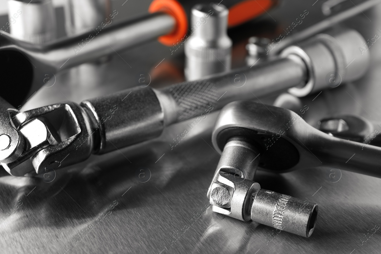 Photo of Auto mechanic's tools on metallic surface, closeup