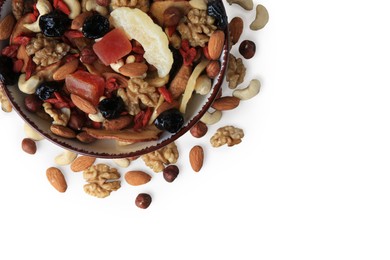 Bowl with mixed dried fruits and nuts on white background, top view