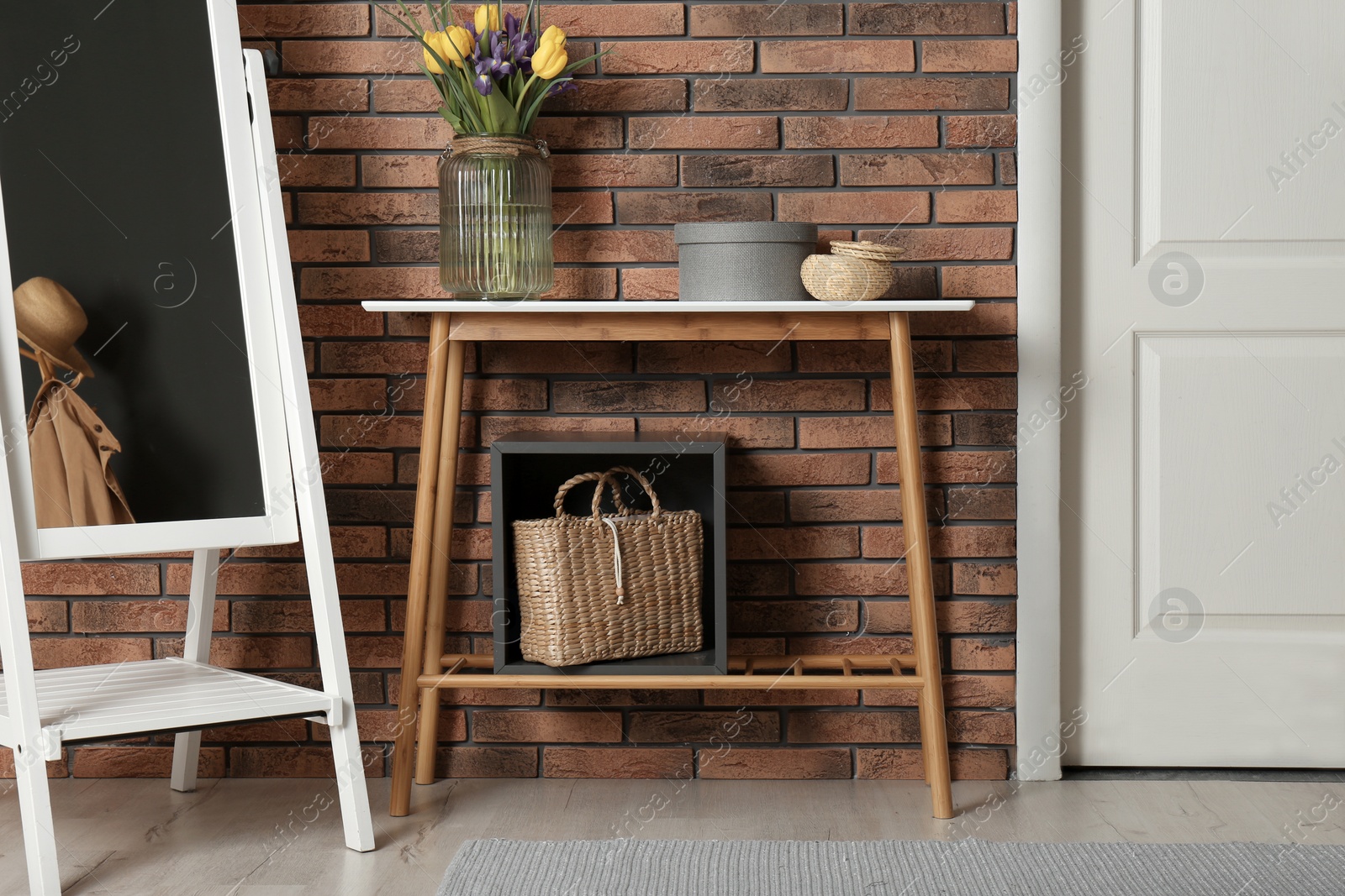 Photo of Hallway interior with stylish table and mirror