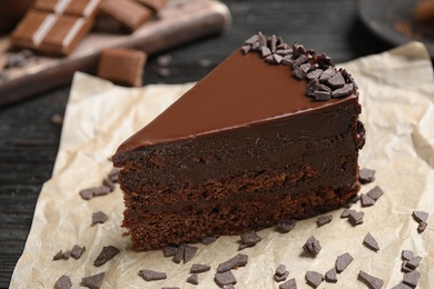 Photo of Delicious fresh chocolate cake on table, closeup