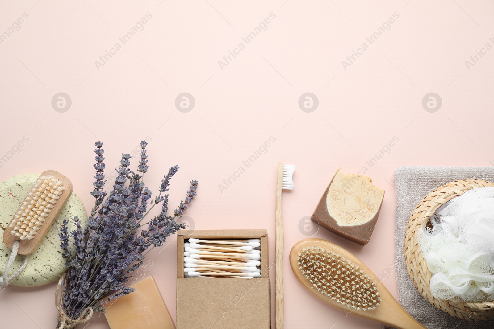 Photo of Bath accessories. Flat lay composition with personal care products on pink background, space for text