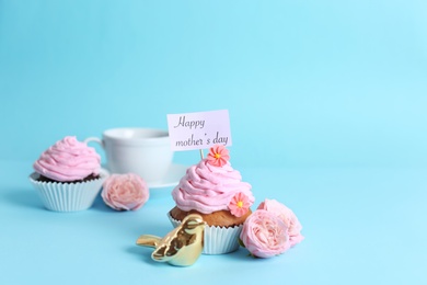 Photo of Festive surprise with tasty treat for Mother's Day on color background