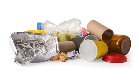 Photo of Pile of different garbage on white background. Trash recycling