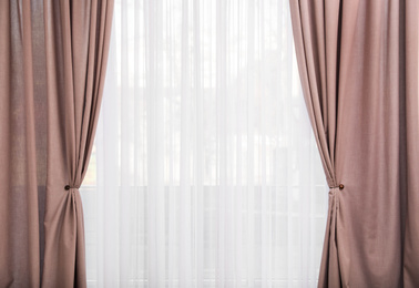 Window with elegant curtains indoors. Interior element