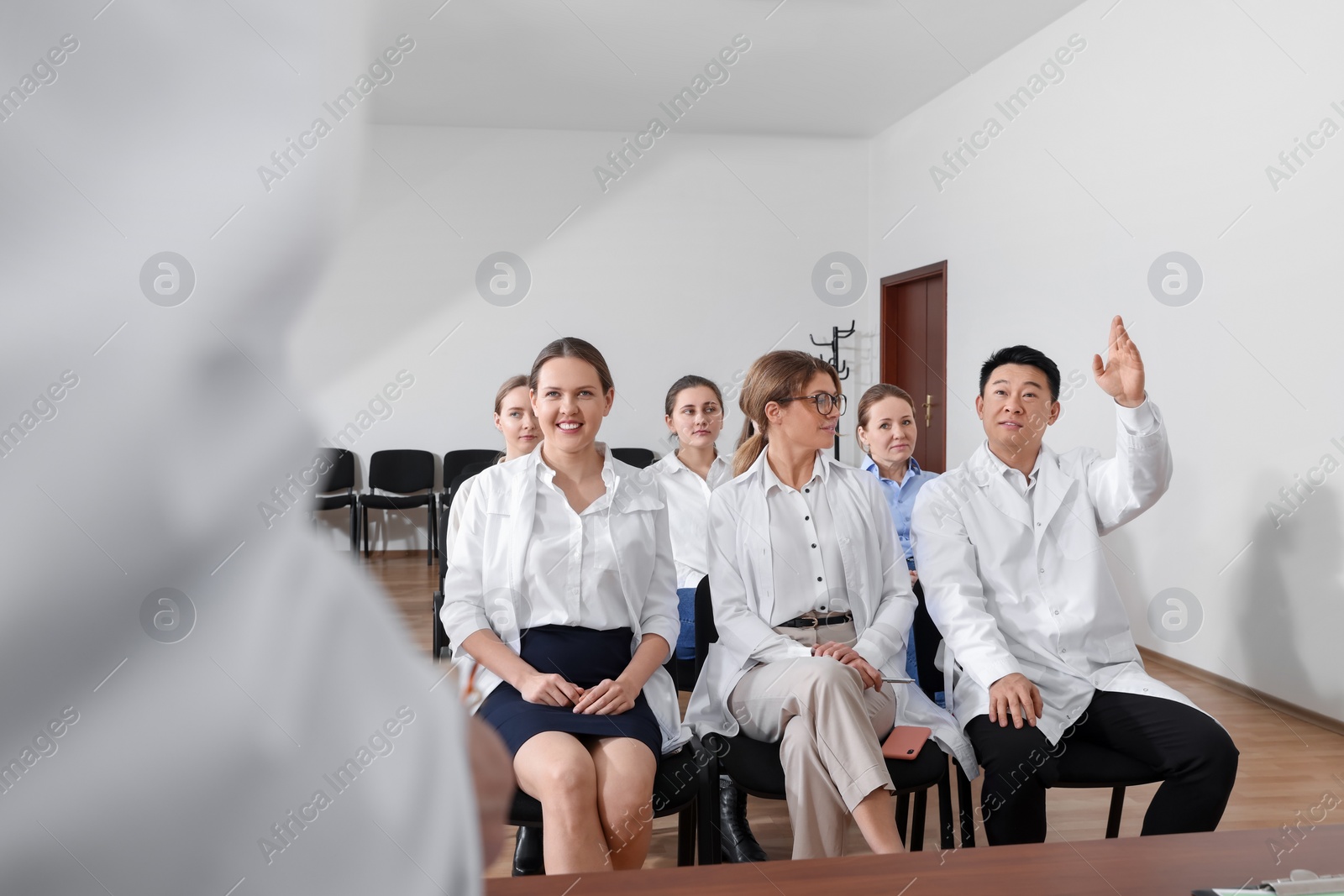 Photo of Team of doctors on medical conference in meeting room