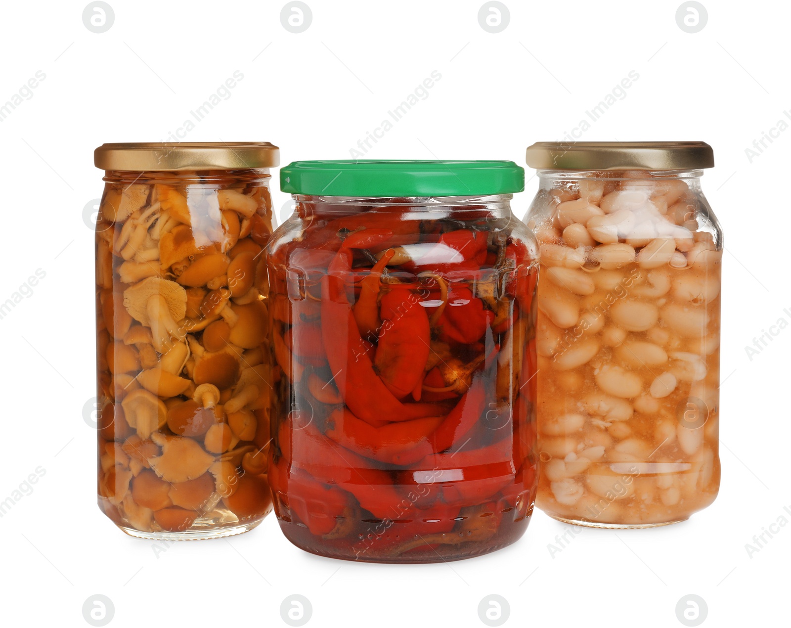 Photo of Glass jars of different pickled vegetables isolated on white