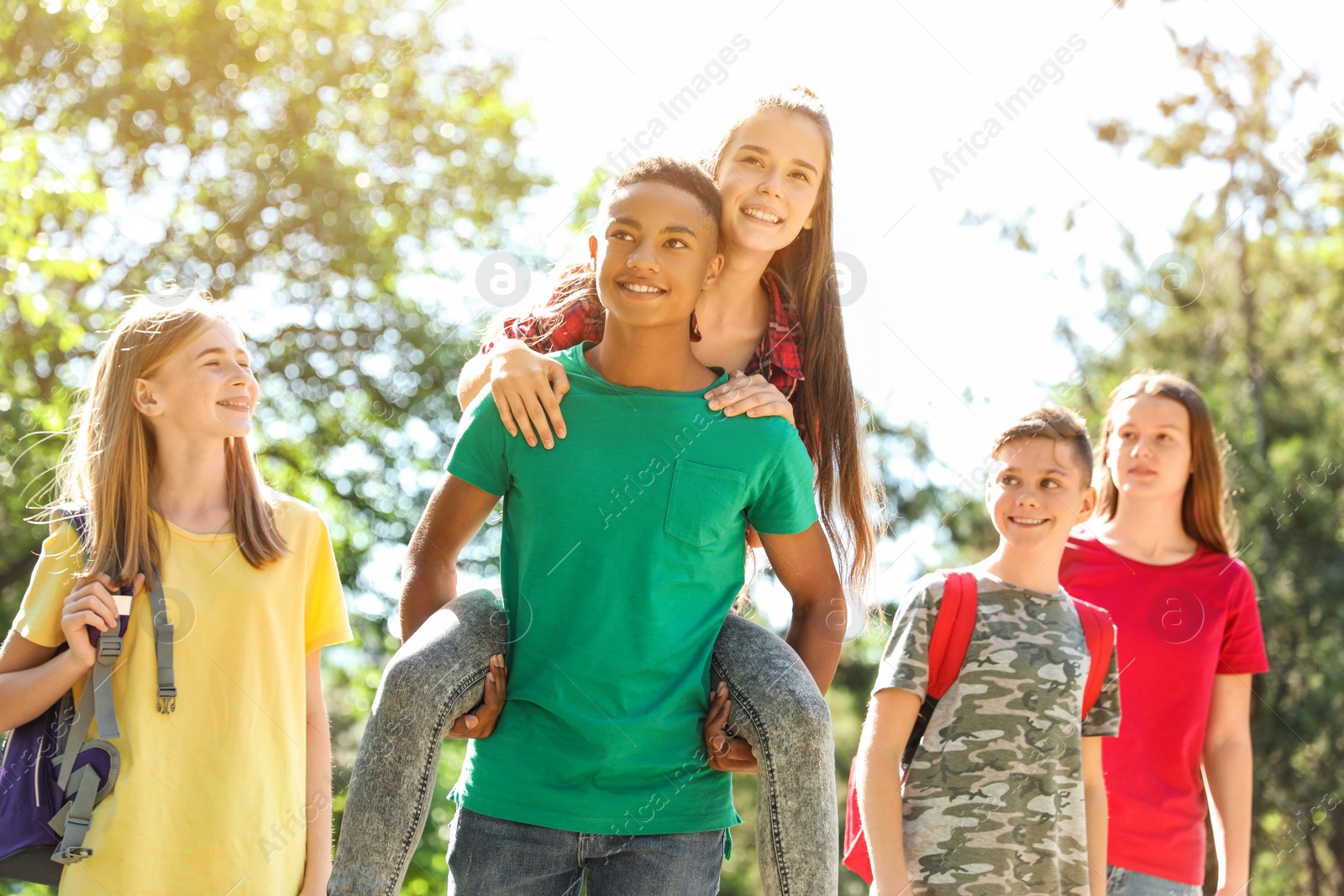 Photo of Group of children outdoors on sunny day. Summer camp
