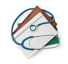 Photo of Stethoscope and notebooks on white background, top view. Medical students stuff