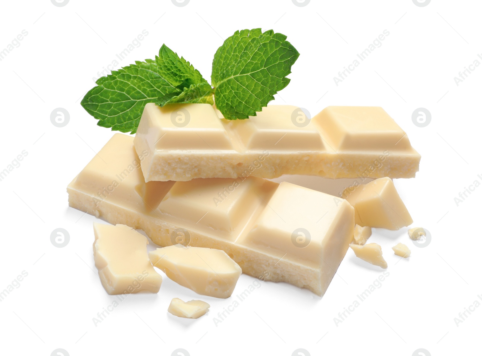 Photo of Pieces of white chocolate with mint on white background