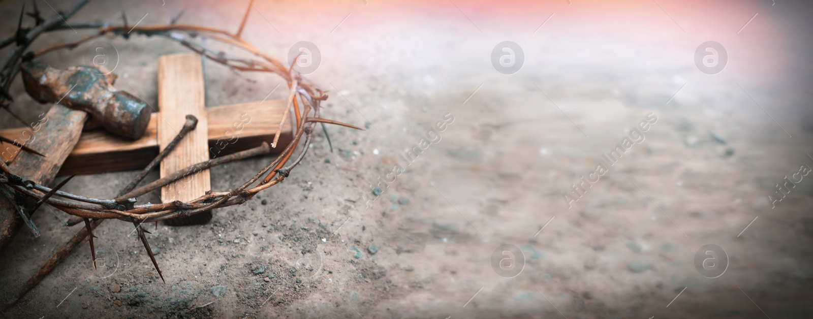 Image of Passion Of Jesus Christ. Crown of thorns, wooden cross and hammer with nails on ground, banner design