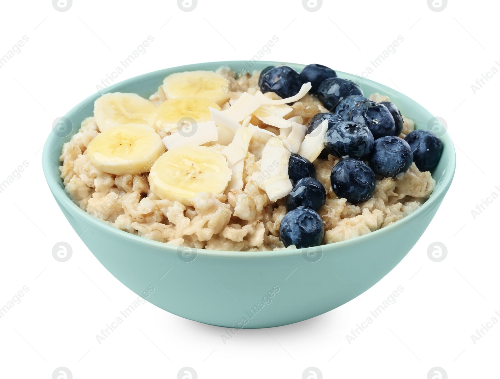 Photo of Tasty oatmeal with banana, blueberries and coconut flakes in bowl isolated on white