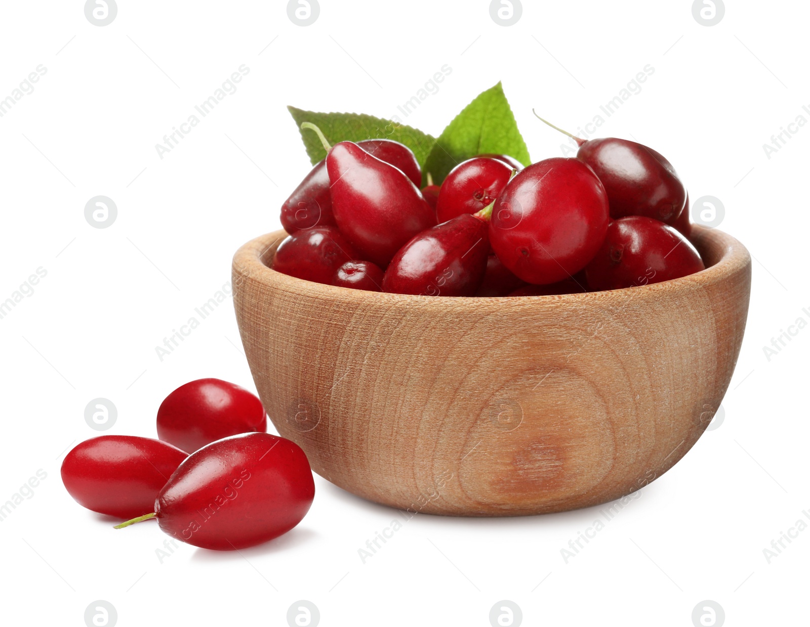 Photo of Fresh ripe dogwood berries with green leaves in wooden bowl on white background