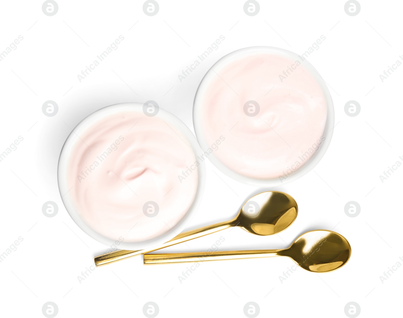 Photo of Tasty organic yogurt in bowls and spoons isolated on white, top view