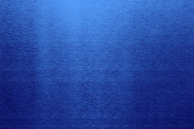 Image of Beautiful blue foil as background, top view