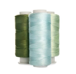 Photo of Different colorful sewing threads on white background