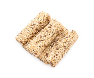 Photo of Tasty sesame seed bars isolated on white