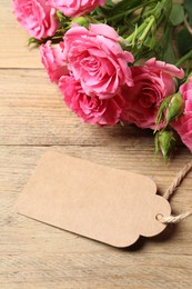 Photo of Happy Mother's Day. Beautiful flowers and blank card on wooden table