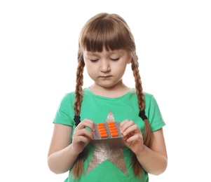 Photo of Little child with pills on white background. Danger of medicament intoxication