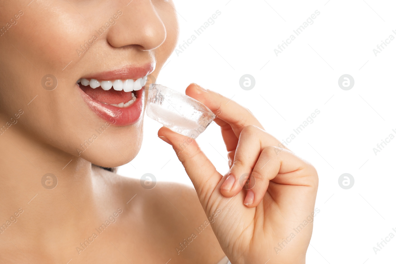 Photo of Young woman with ice cube on white background, closeup