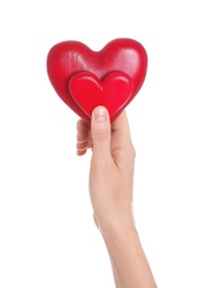 Photo of Woman holding decorative hearts in hand on white background, closeup