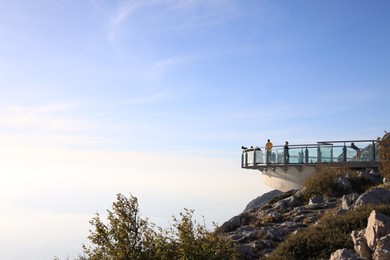 Photo of Mountain with observation deck under sky outdoors